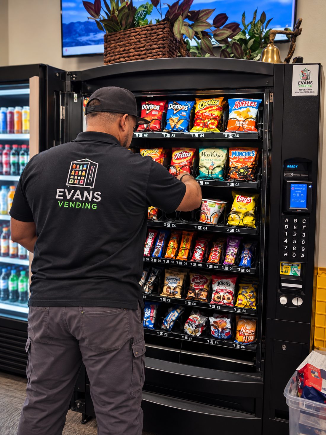 Technician restocking a vending machine